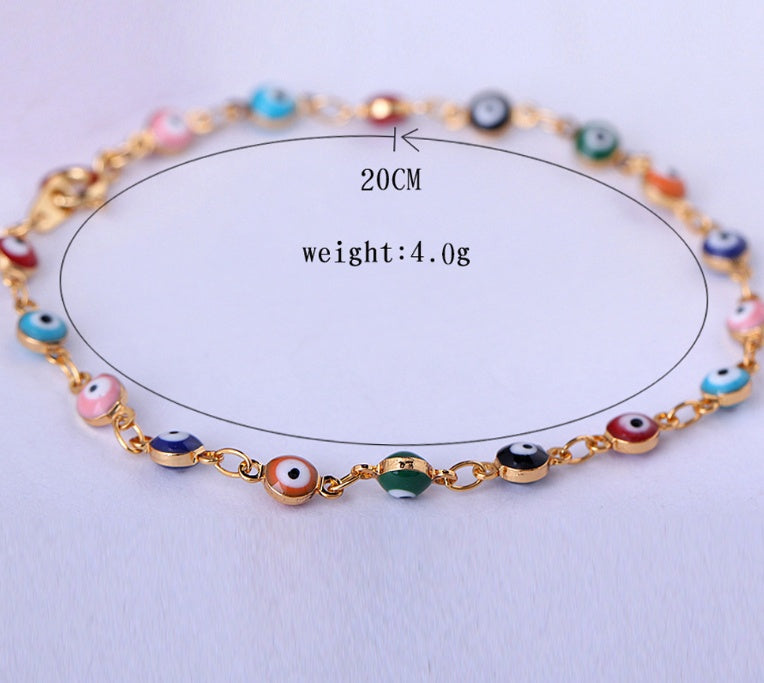 Bracelet with colorful evil eye beads on a white background