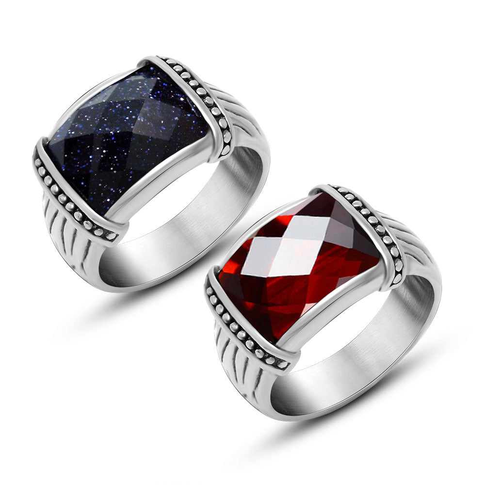 Two silver rings with gemstones on a white background