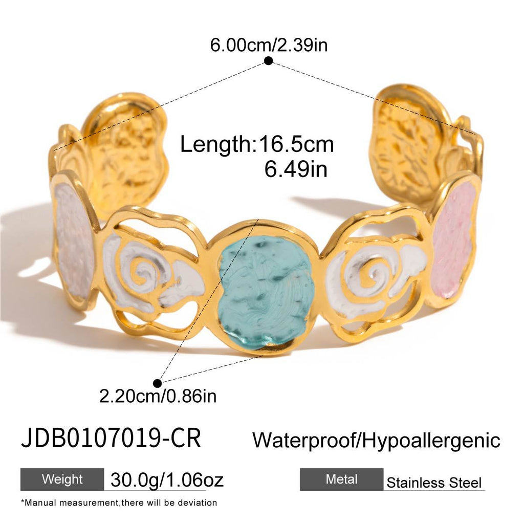 Gold bracelet with colorful stones and measurement details on a white background