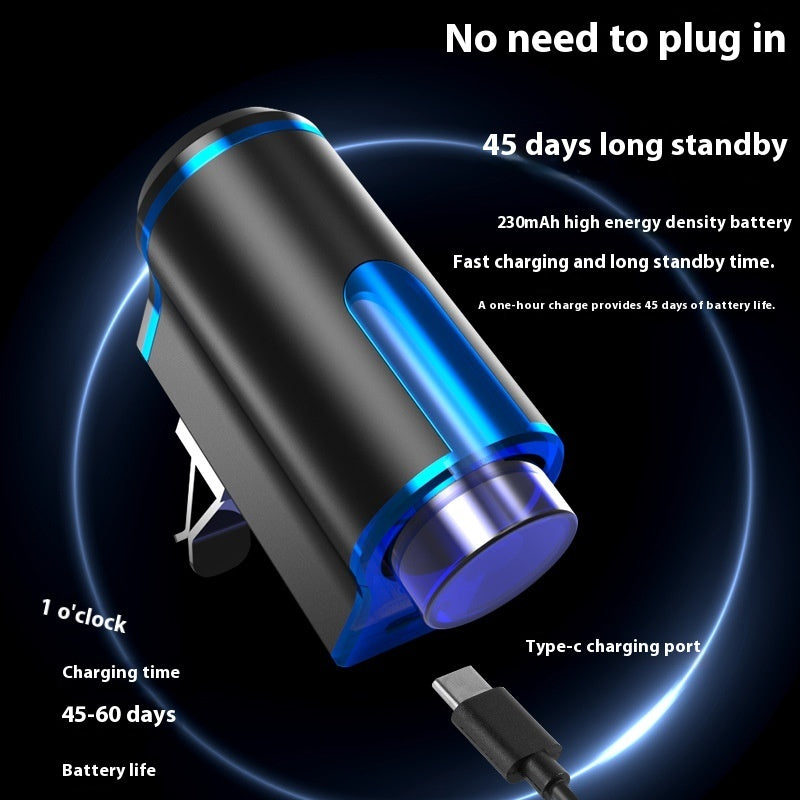 Black and blue electronic device with charging cable on a dark background