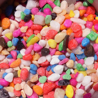 Colorful heart-shaped candies on a white background