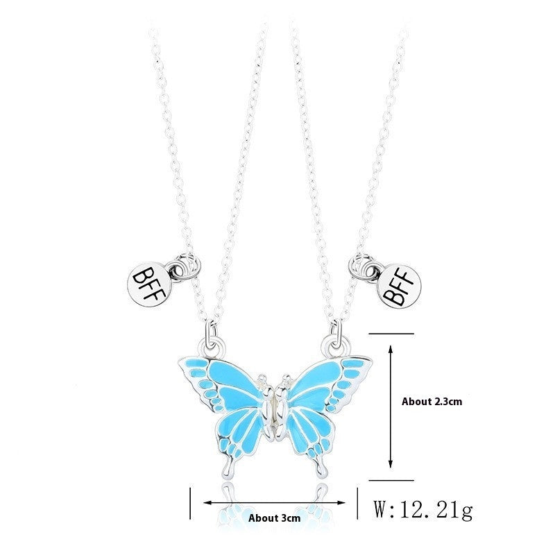Butterfly necklace with 'BFF' charms on a white background