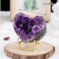 Purple crystal on a wooden stand with measurement details