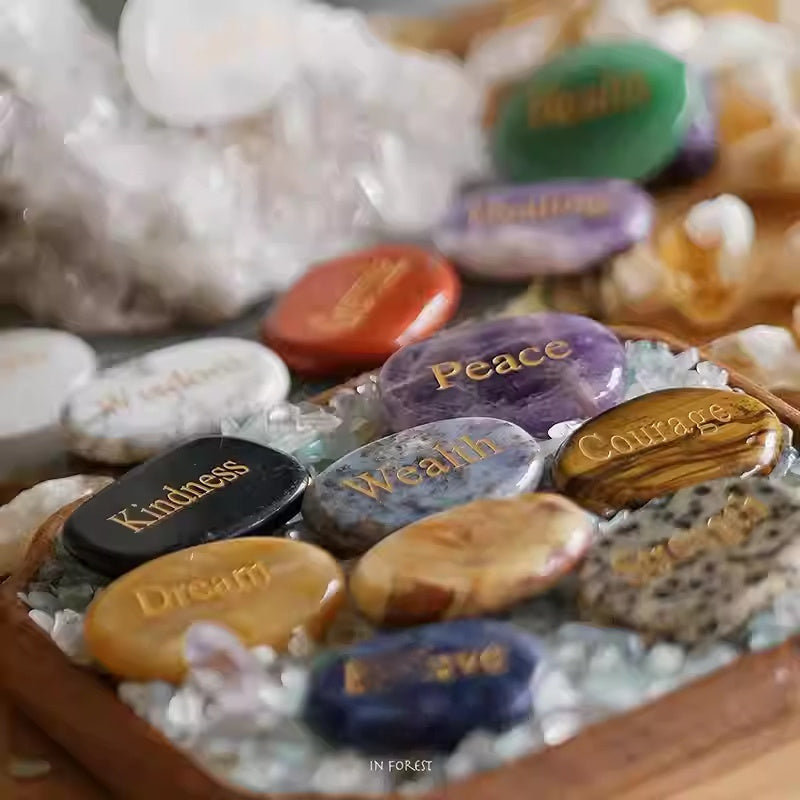 Decorative stones with engraved words in a wooden box