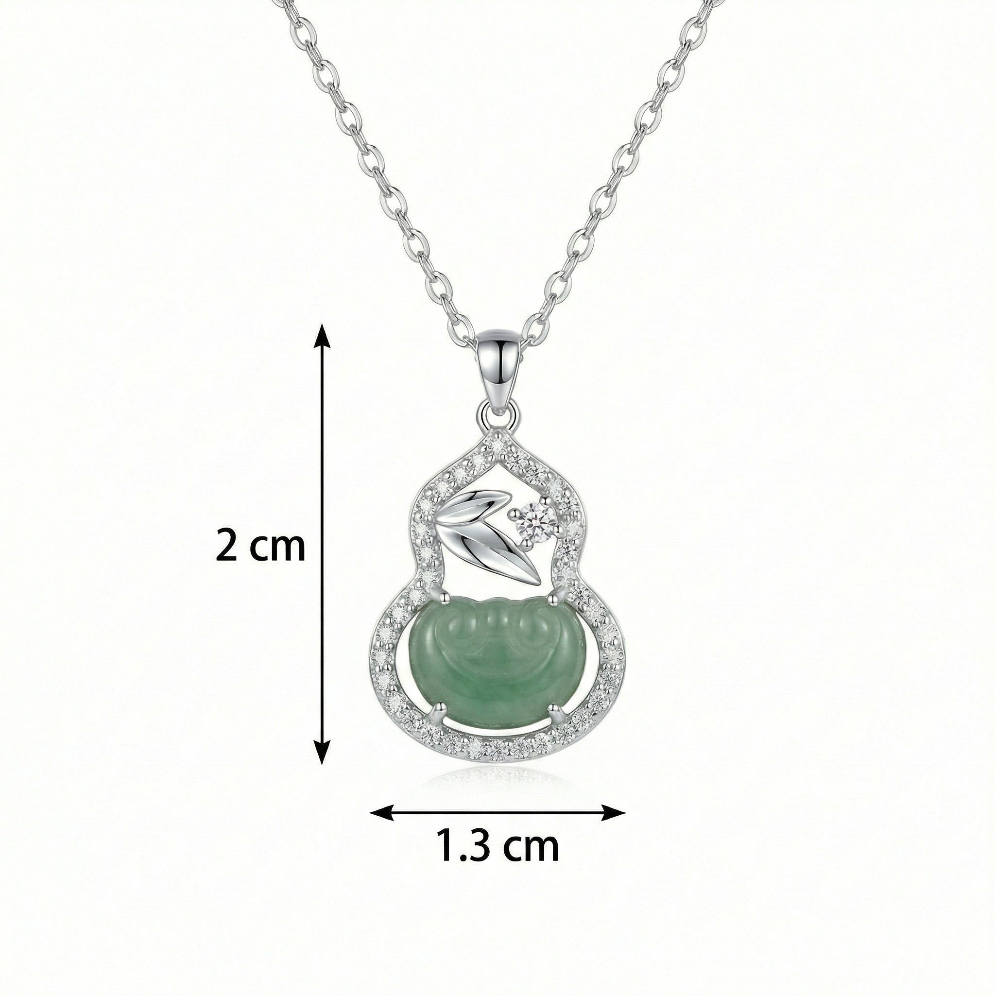 Silver necklace with a green pendant and measurements on a white background
