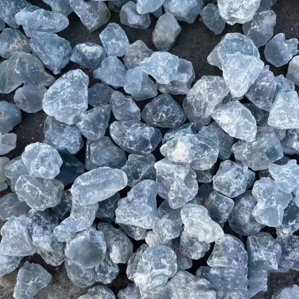 Close-up of blue stone chips on a dark surface