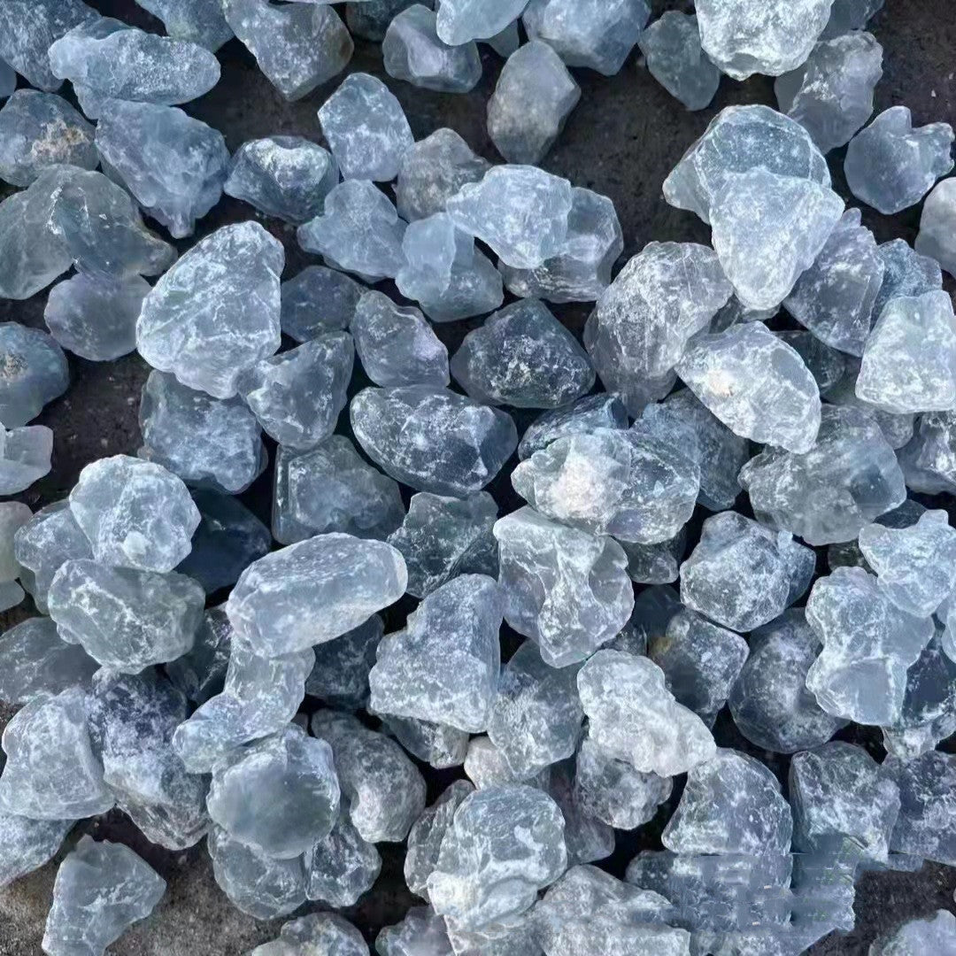 Close-up of blue stone chips on a dark surface