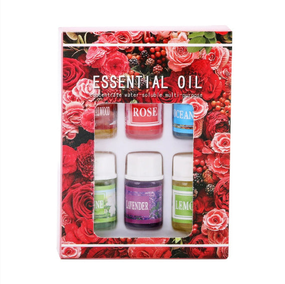 Set of essential oils in a decorative box with floral design