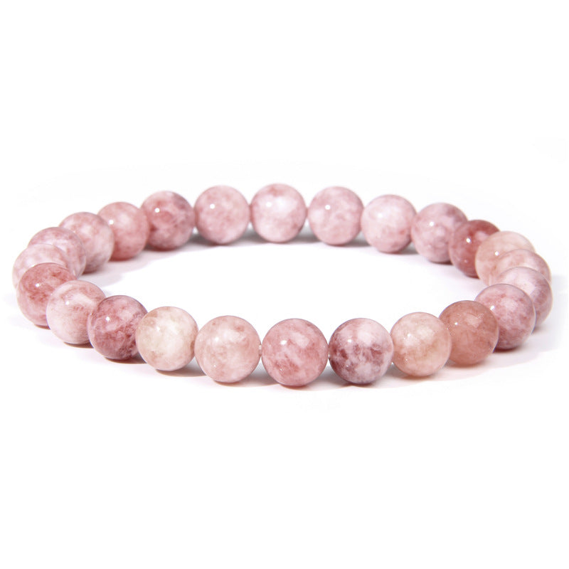 Pink beaded bracelet on a white background