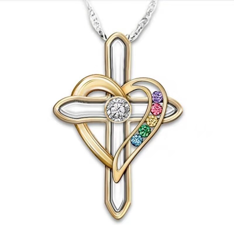 Gold cross pendant with heart design and colored gemstones on a white background