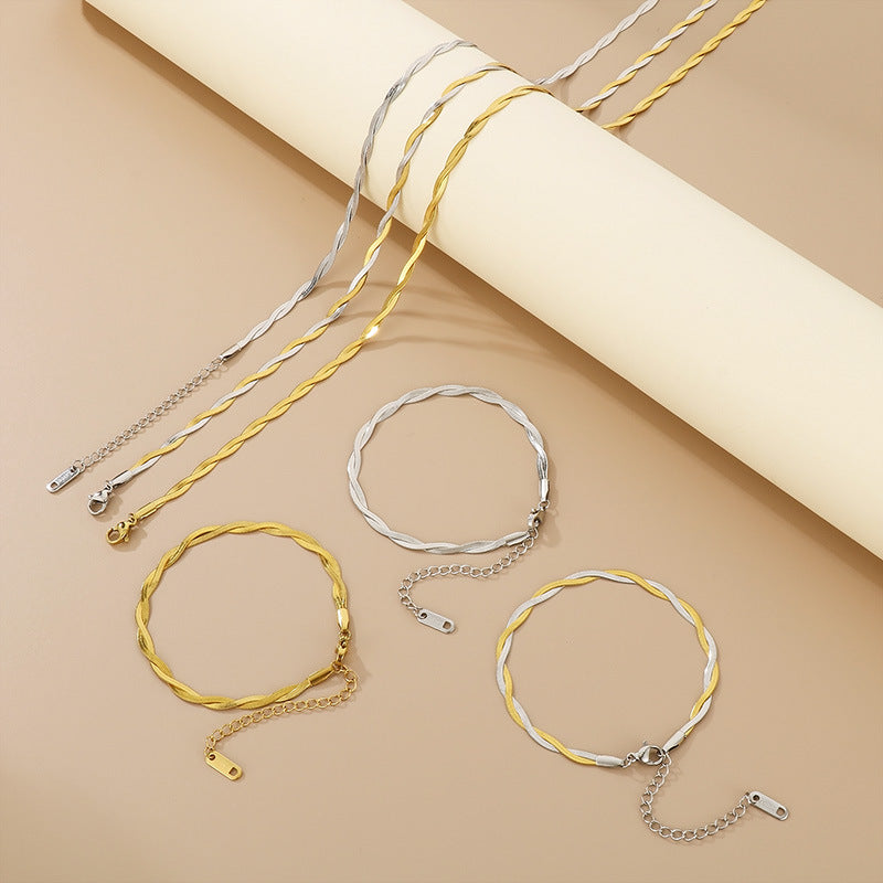 Gold and silver bracelets on a beige background