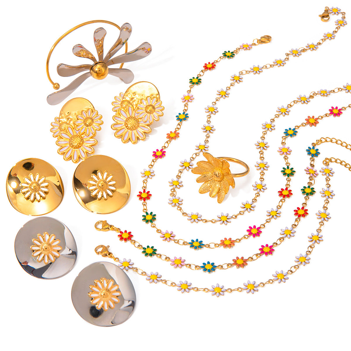Gold jewelry set with floral designs on a white background