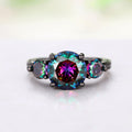 Multicolored gemstone ring with a white background