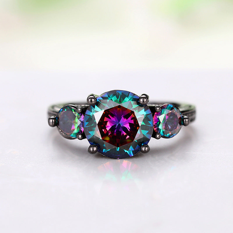 Multicolored gemstone ring with a white background