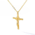 Gold crucifix pendant necklace on a white background