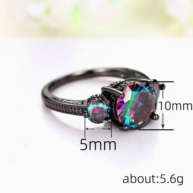 Ring with a large colorful gemstone and smaller round gemstones, with measurements indicated on a white background.