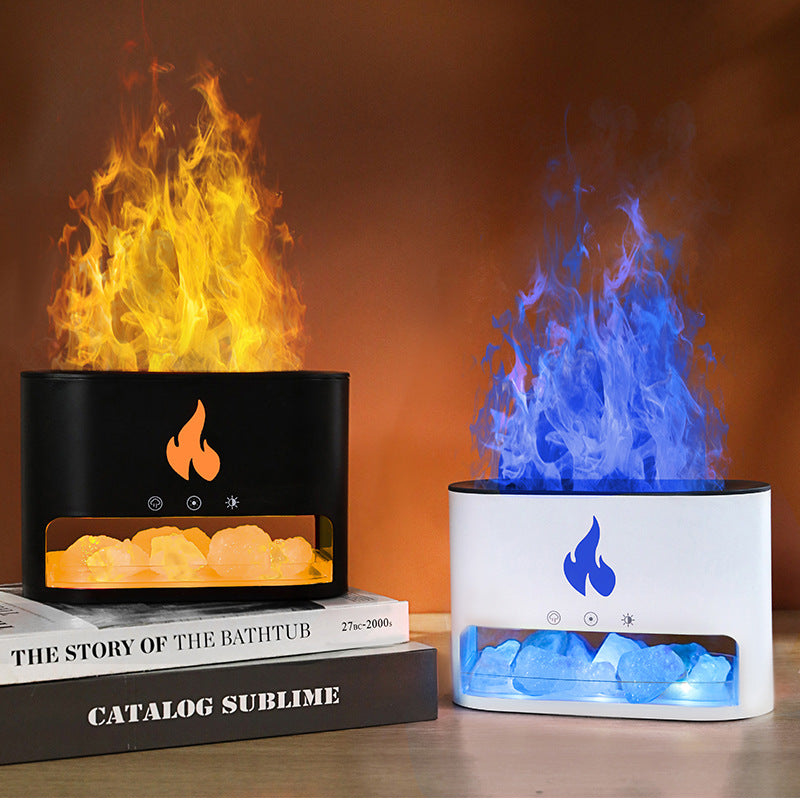 Two flame-shaped lamps, one with orange flames and the other with blue flames, on a table.