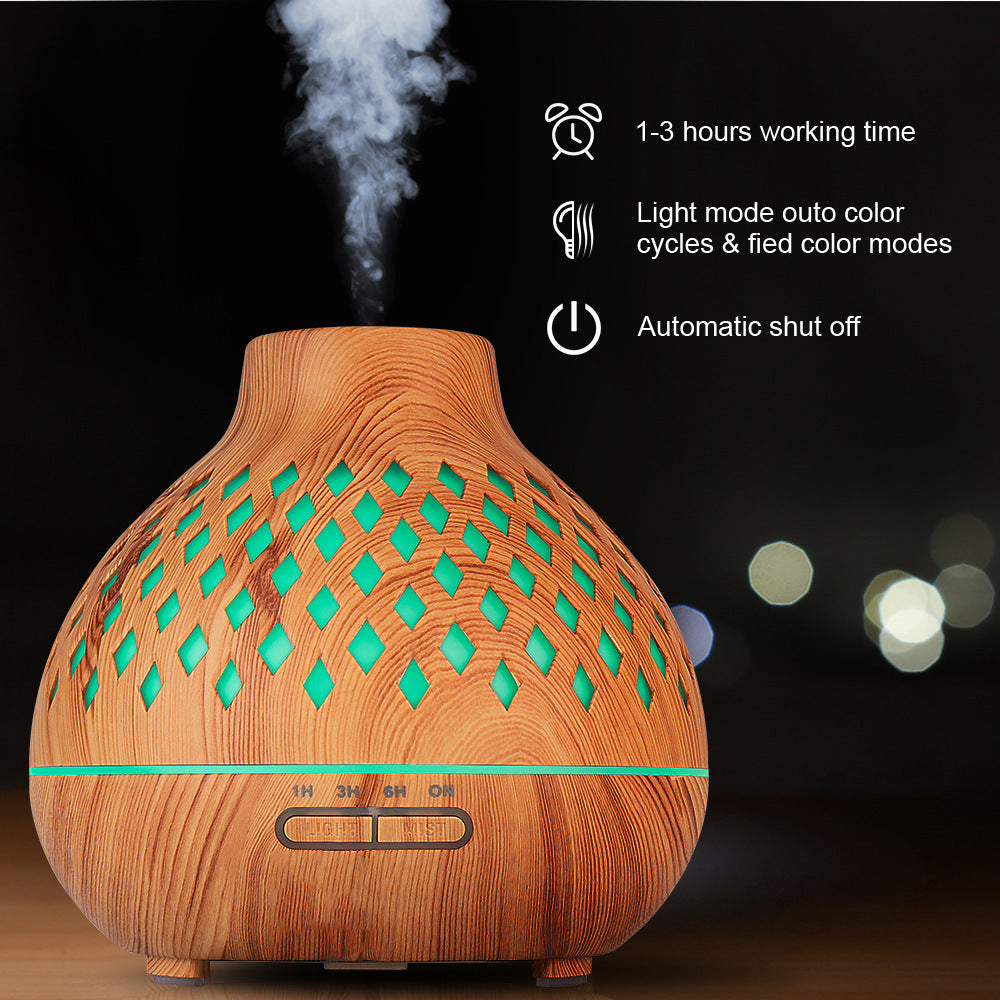 Wooden diffuser with green lights on a dark background