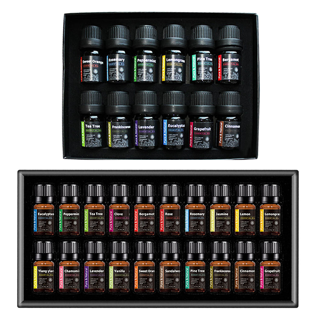 Set of essential oil bottles in two black display boxes on a white background