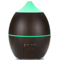 Wooden-textured diffuser with green accents on a white background