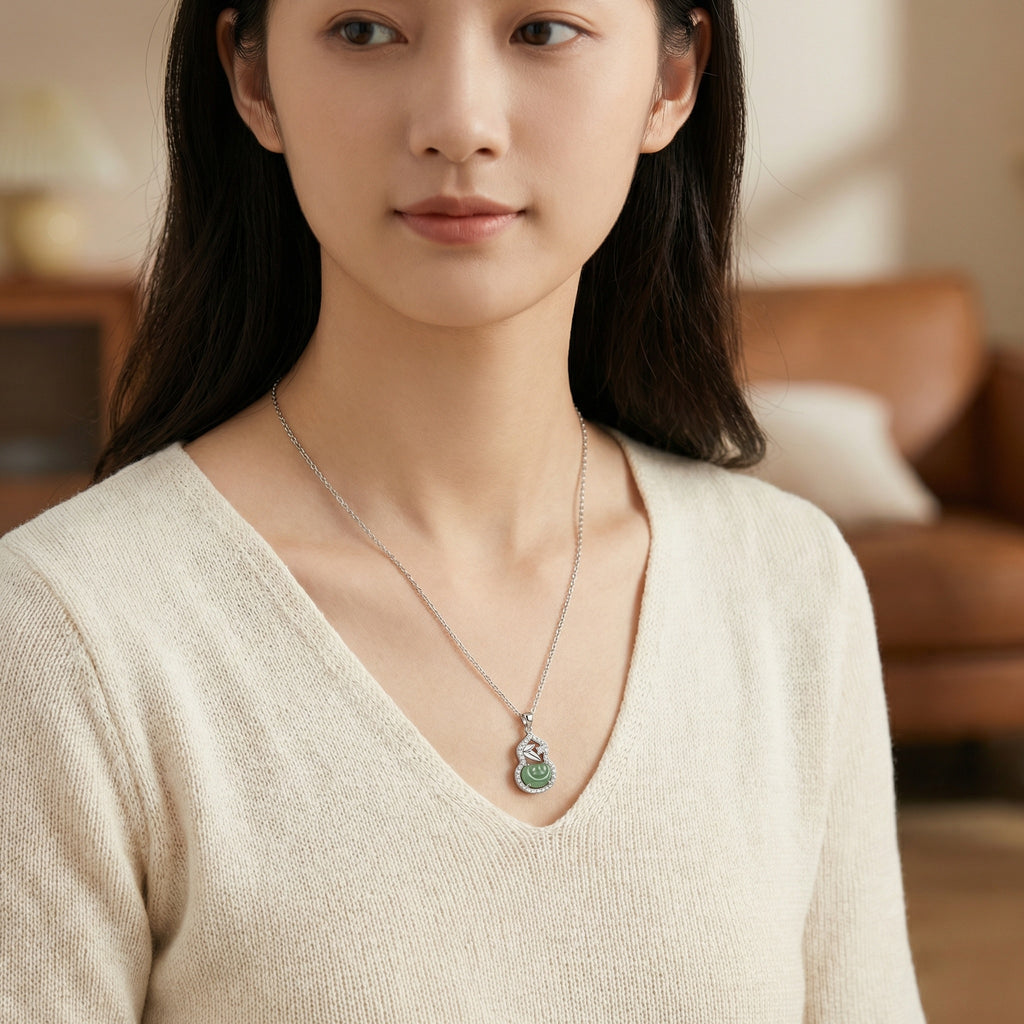 Woman wearing a necklace with a pendant in a blurred indoor setting