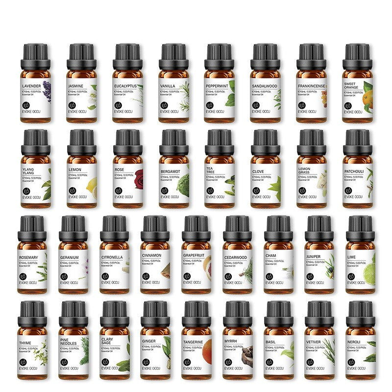 Collection of various essential oil bottles with labels on a white background