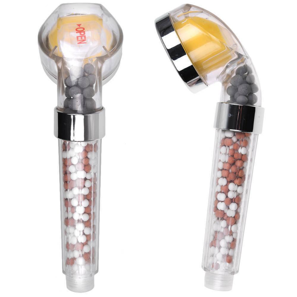 Two handheld shower heads with visible filter elements on a white background