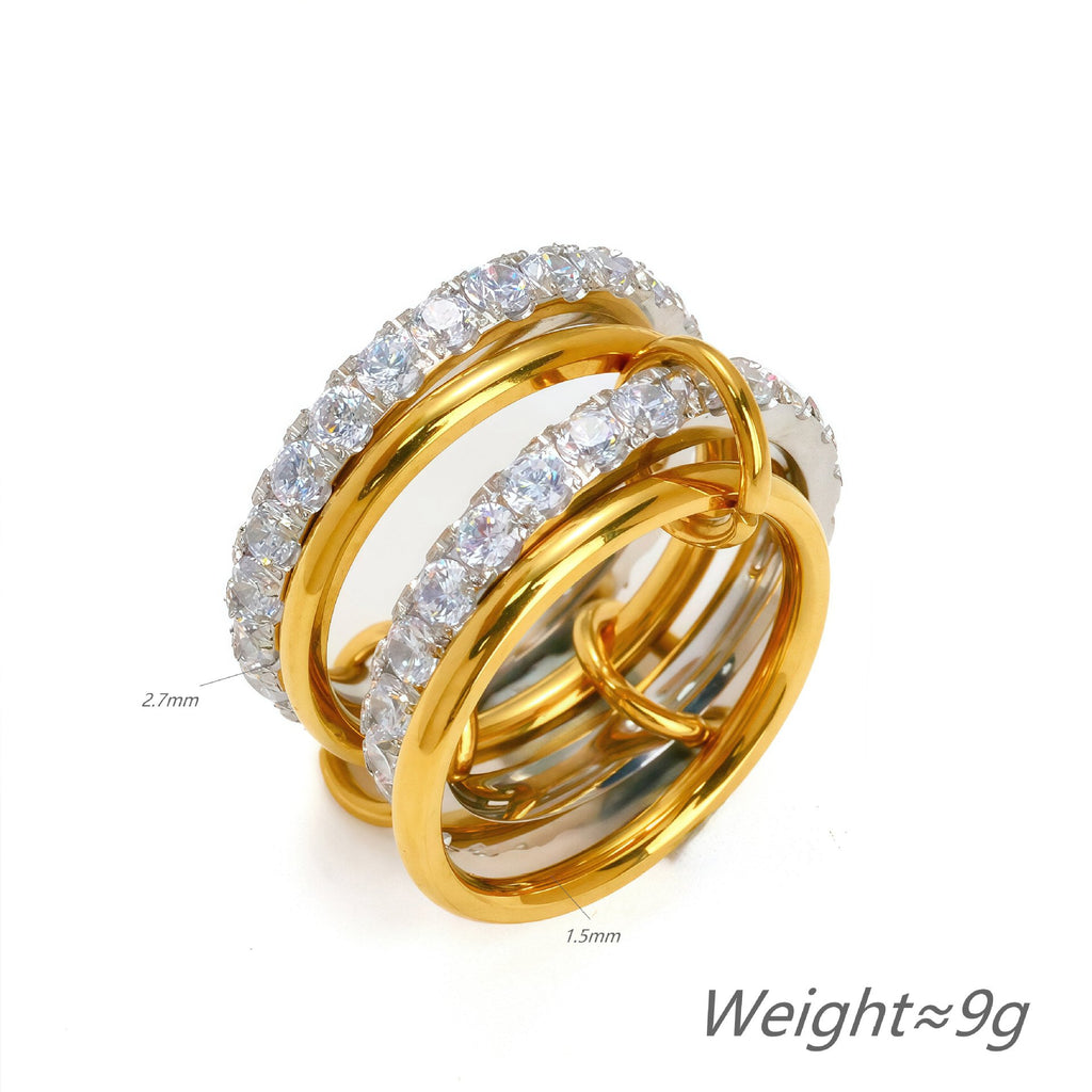 Three gold and silver rings with diamond accents on a white background