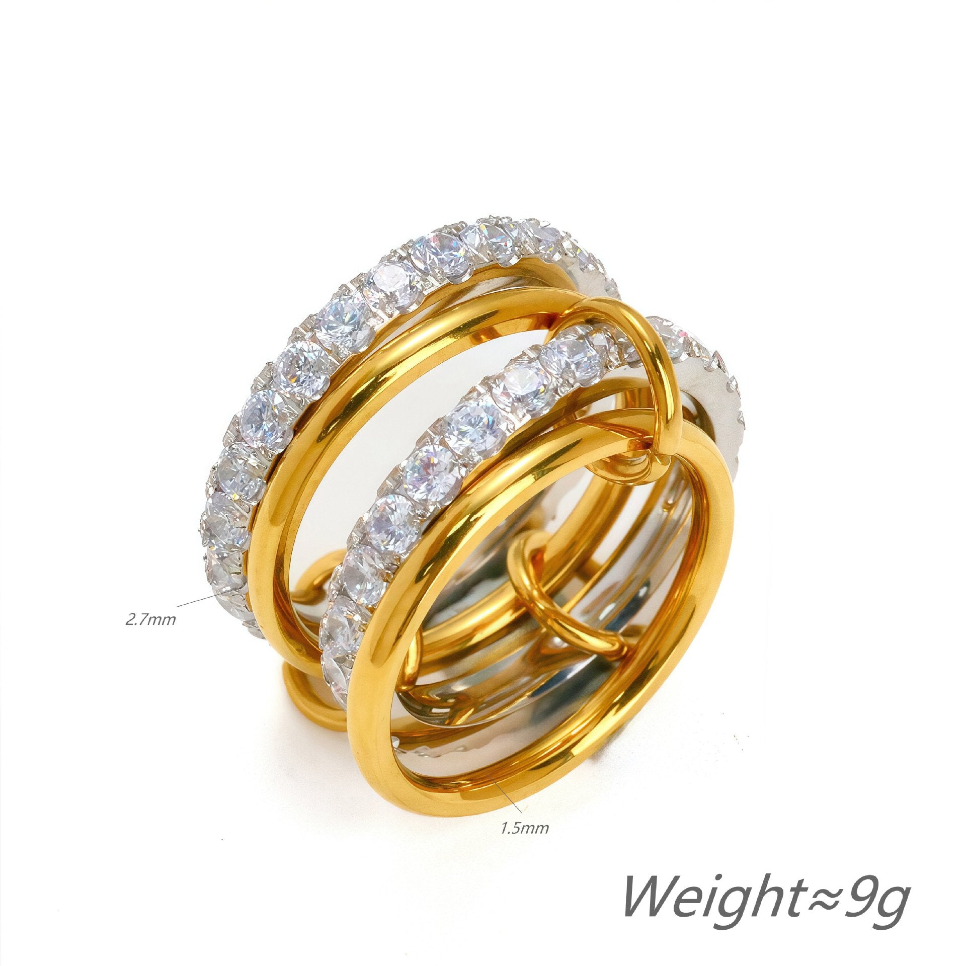 Three gold and silver rings with diamond accents on a white background