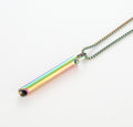 Multicolored cylindrical pendant on a chain against a white background