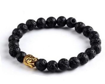 Black beaded bracelet with a gold charm on a white background