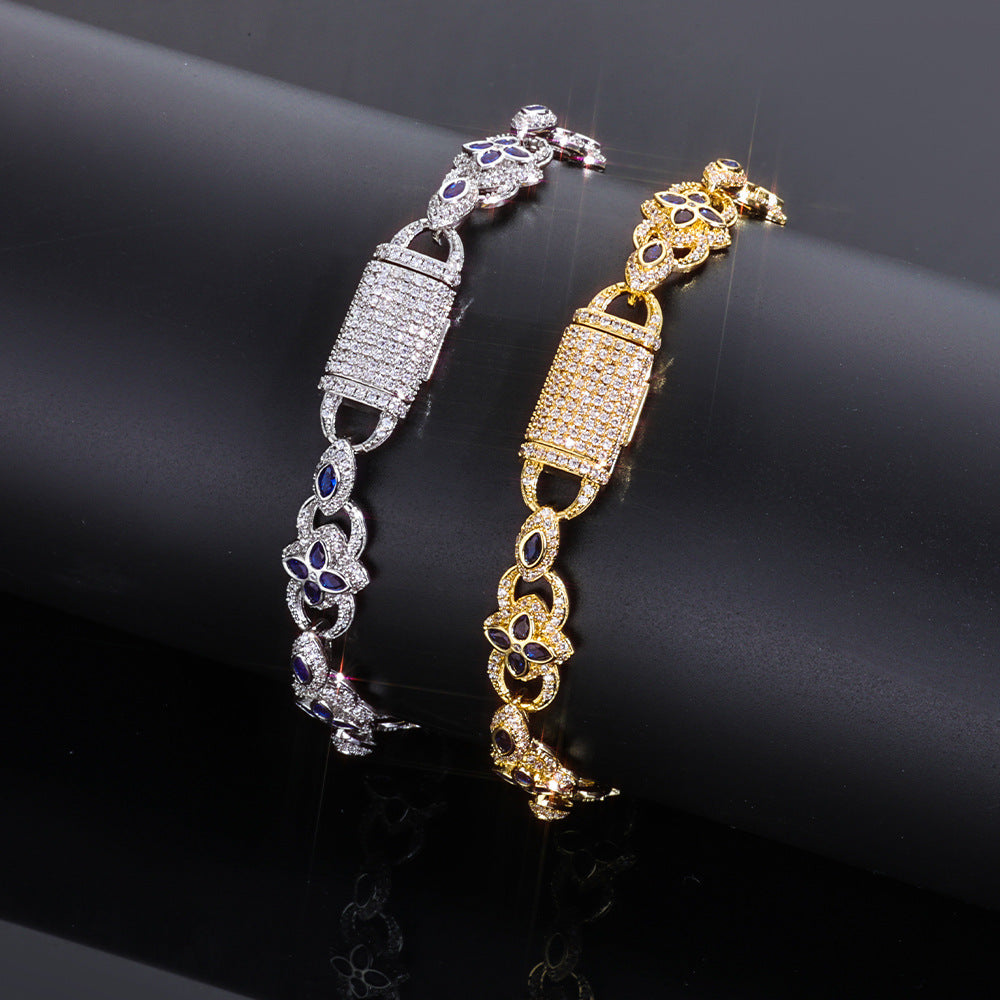 Gold and silver bracelets with intricate designs on a black background