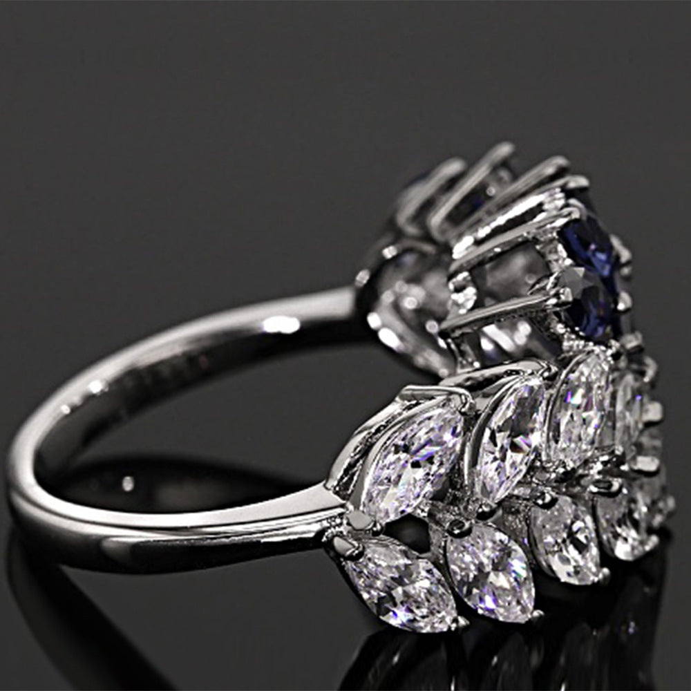 Silver ring with gemstones on a black background