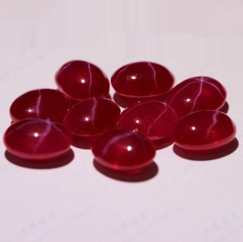 Red stones with white veins on a white background