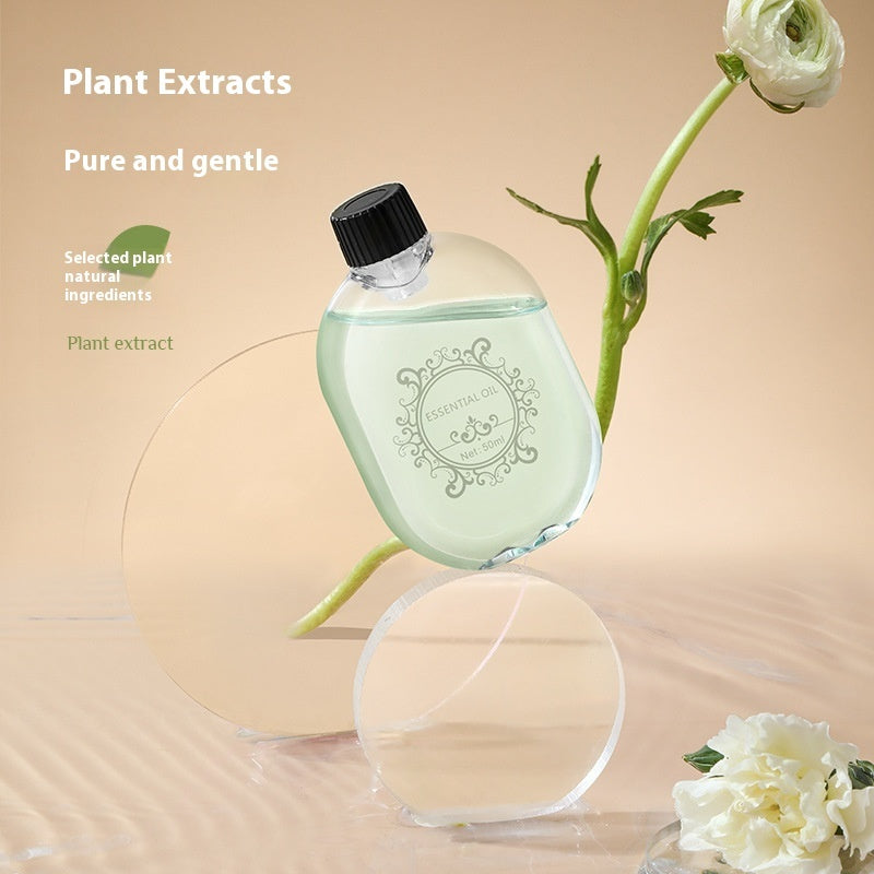 Bottle of plant extract with flowers on a beige background