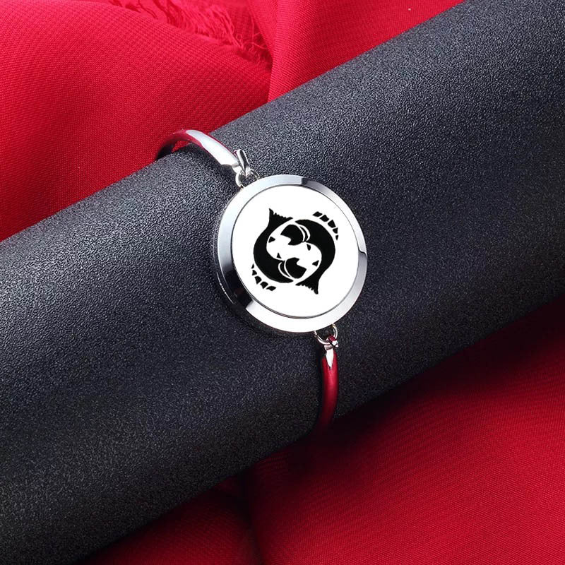 Bracelet with a circular emblem on a red and black background