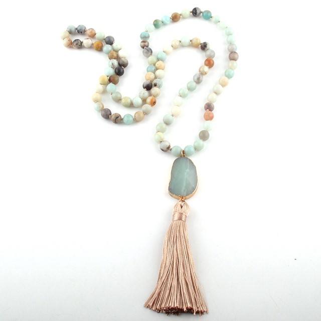 Necklace with beads and tassel on a white background