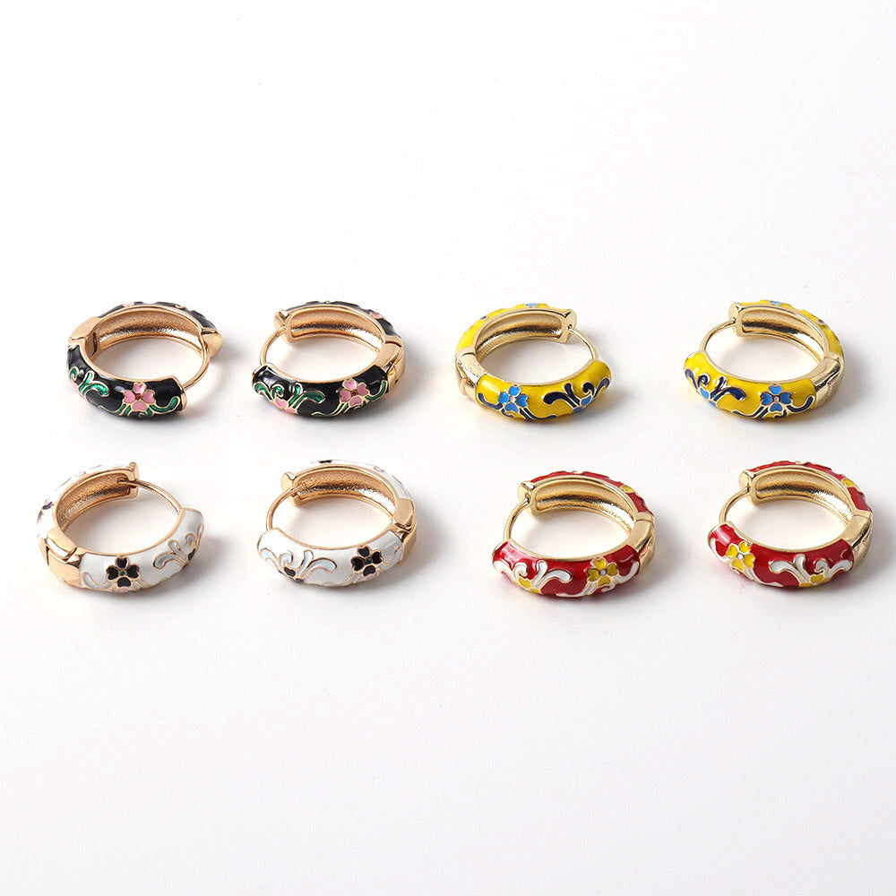 Set of colorful hoop earrings on a white background