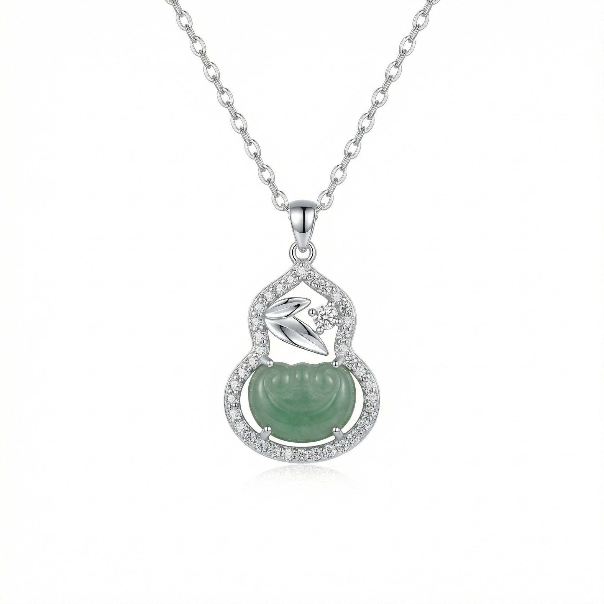 Silver necklace with a green pendant on a white background