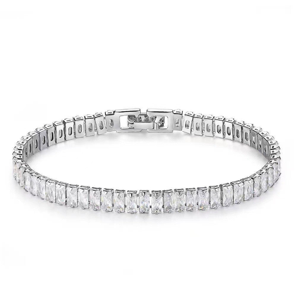 Diamond bracelet with baguette cut stones on a white background