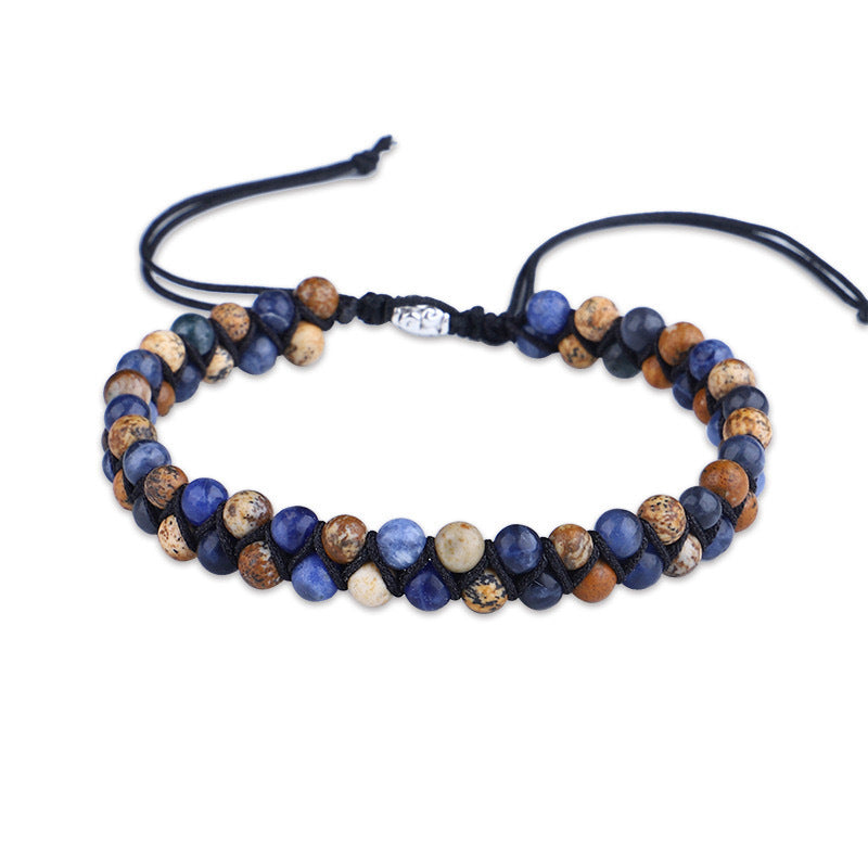 Beaded bracelet with blue and brown stones on a white background