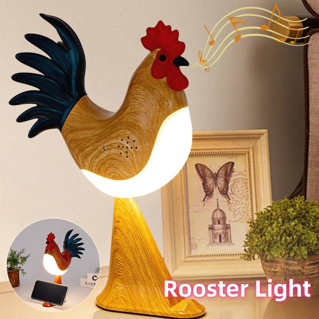 Rooster-shaped night light with a musical note above it, placed on a surface with a decorative background.