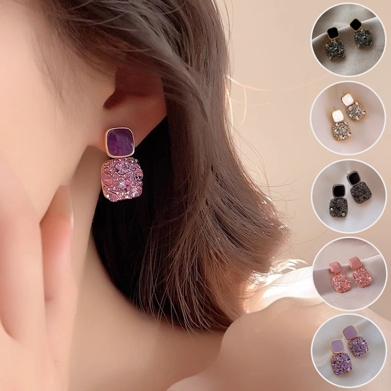 Close-up of a person wearing a sparkling earring with inset images of other earrings.