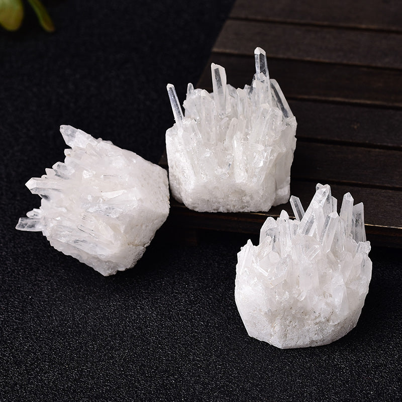 Three crystal formations on a dark surface