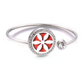 Silver bracelet with a red and white floral design on a white background