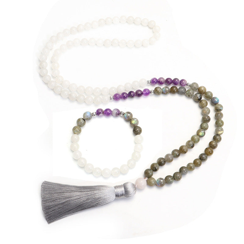 Beaded necklace with tassel and bracelet on a white background