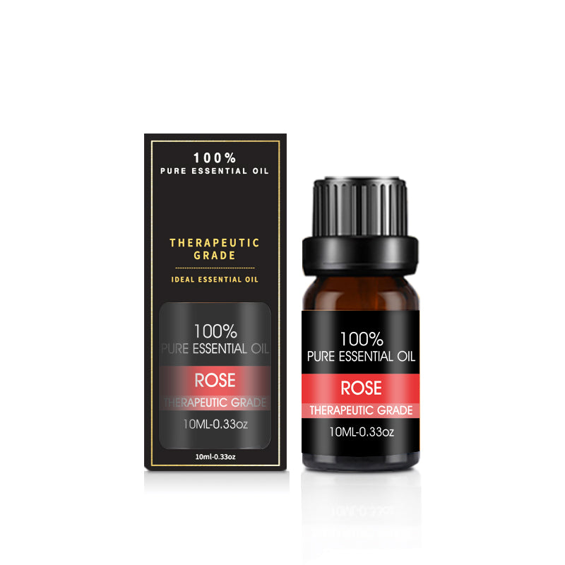 Rose essential oil bottle and packaging on a white background