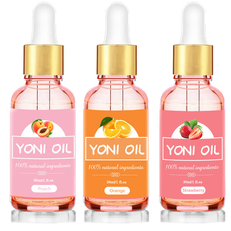 Three bottles of Yoni Oil with different fruit flavors on a white background