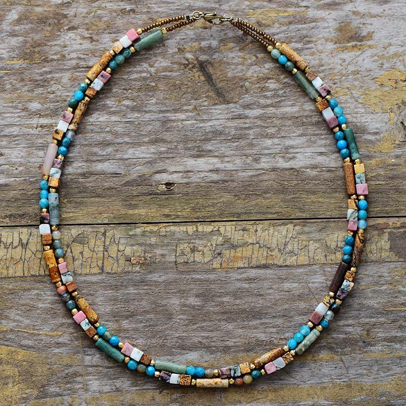 Multicolored beaded necklace on a wooden surface
