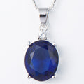 Blue gemstone pendant on a white background